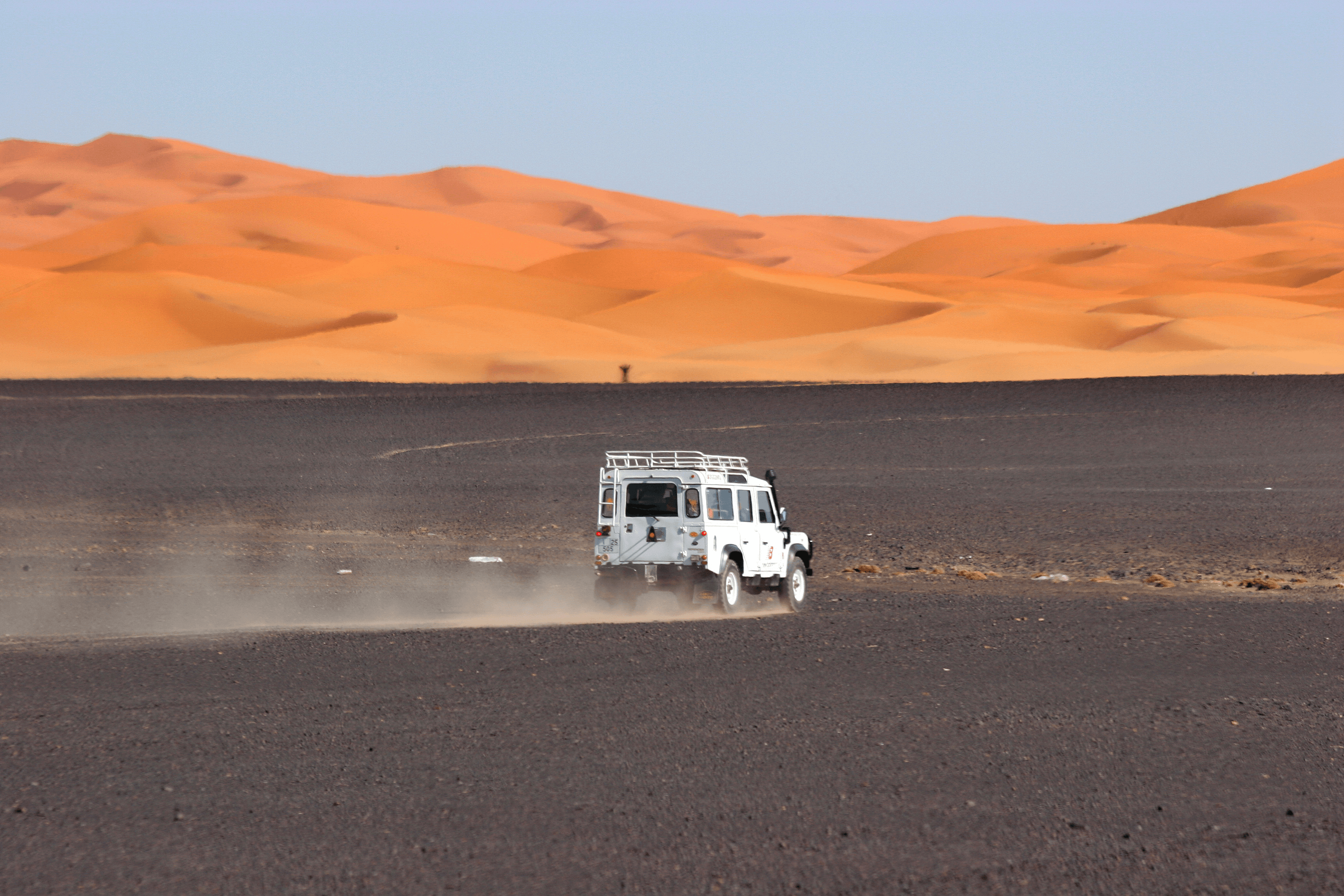 Meteorite expedition vehicle in the Moroccan Sahara dunes near Erfoud